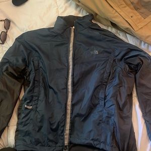Blue and grey north face jacket